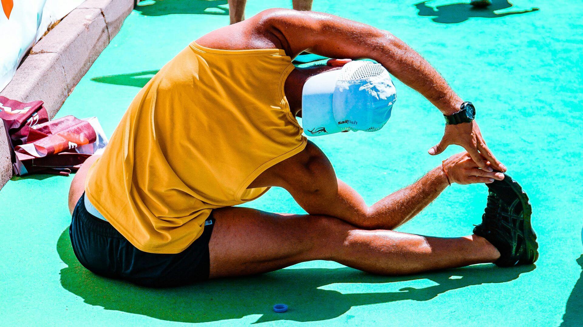 Man stretching before a running race