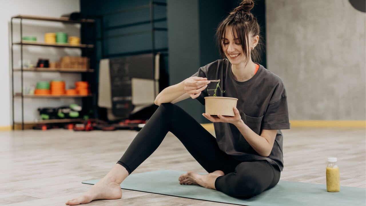 Woman eating her pre-prepared healthy meal