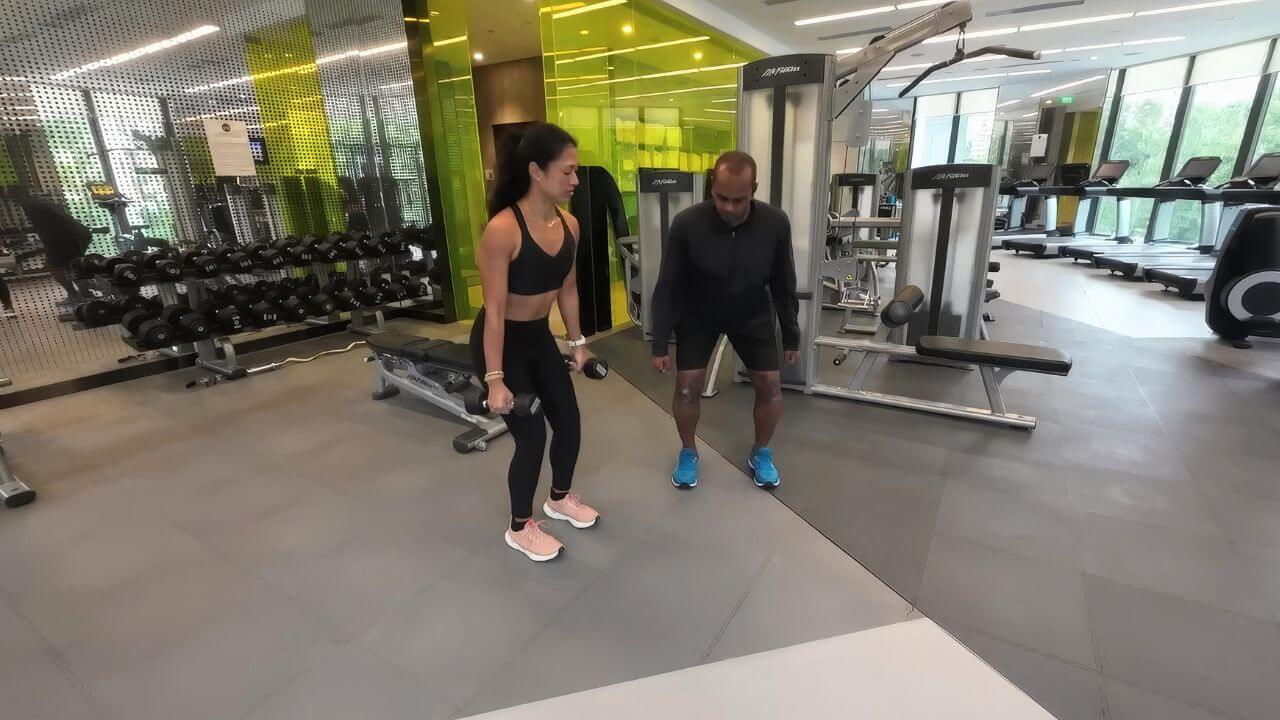 Woman working out with personal trainer from Phyzique Singapore