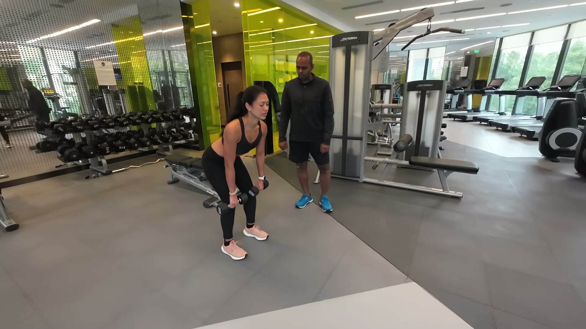 Woman doing stiff leged deadlifts